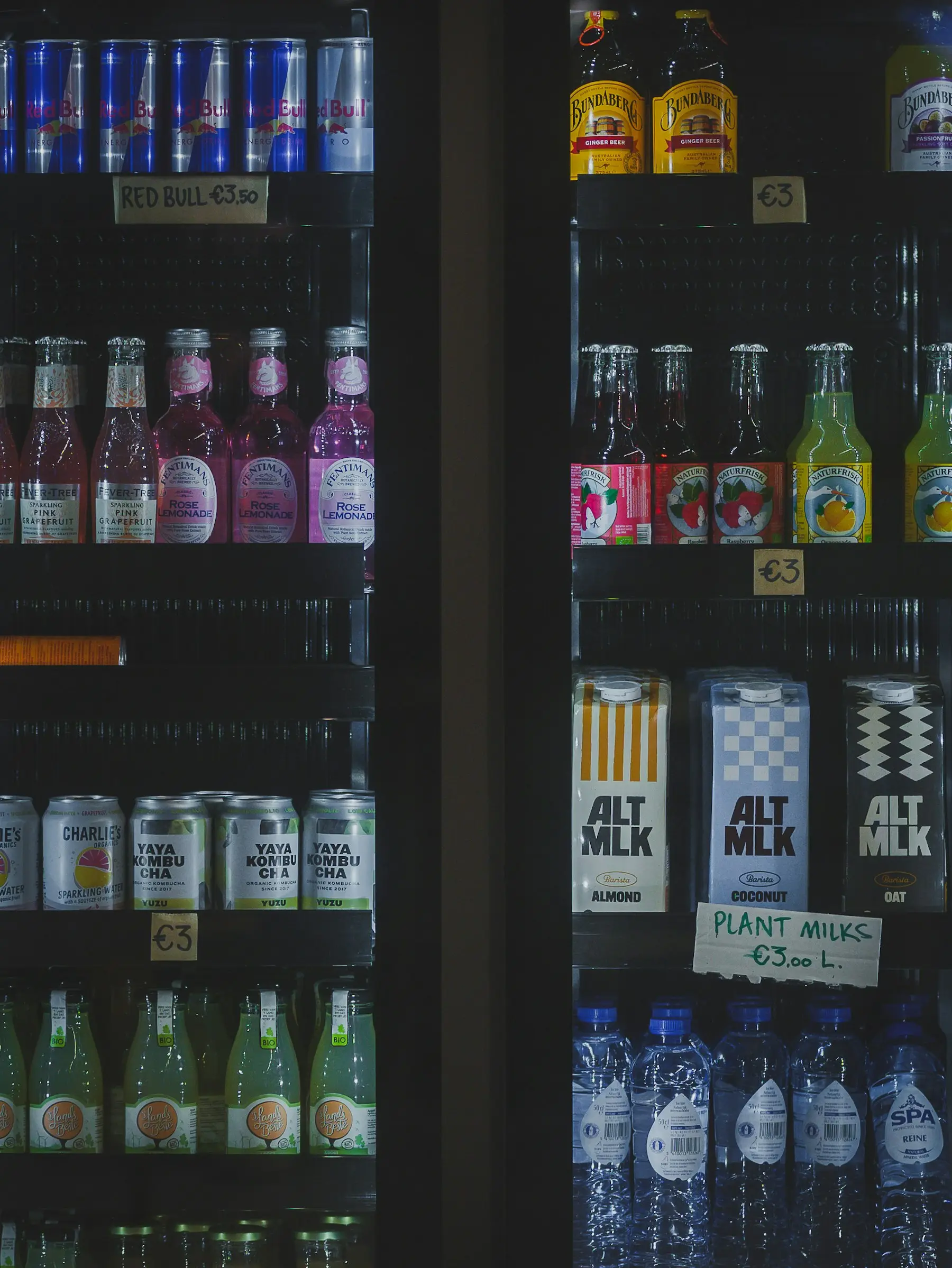 A refrigerated display case with assorted drinks